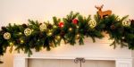 Festive Christmas decorations on a mantelpiece.