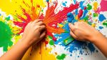 Hands painting with vibrant colors on a canvas.